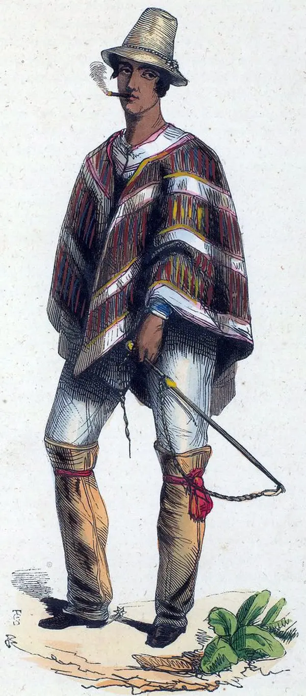 Grabado coloreado a mano de 1843 de un hombre chileno de pie con poncho listado, sombrero y espuelas.